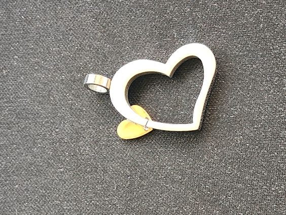 Open-heart pendant in polished stainless stee